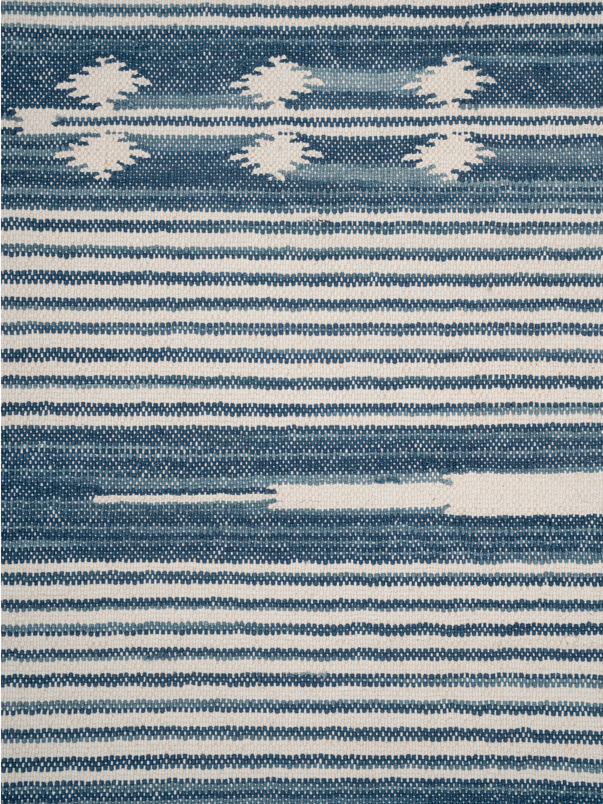 The Subtle Bloom Runner-Blue - cotton runner laid in a hallway view