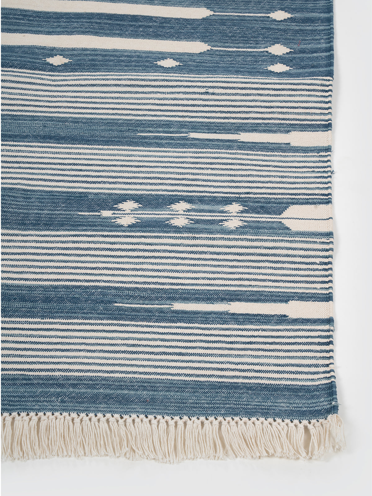The Subtle Bloom Runner-Blue cotton stair runner styled on a staircase in a designed interior