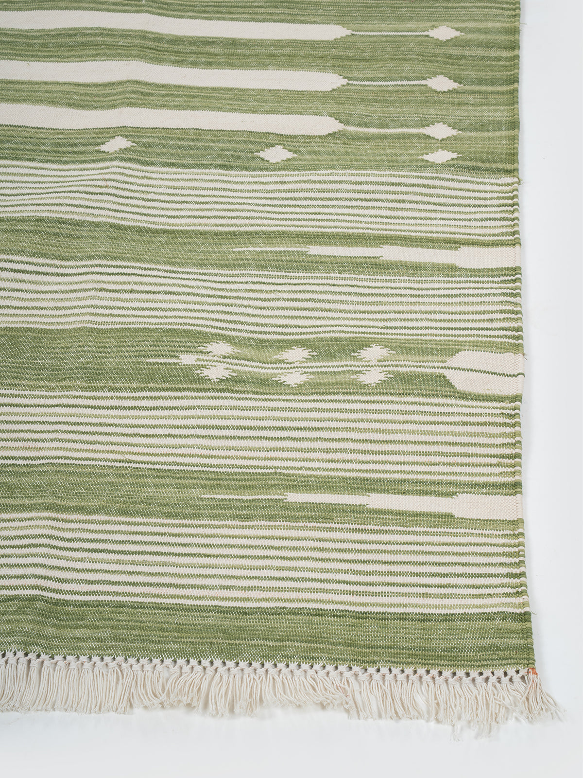 The Subtle Bloom Runner-Green cotton stair runner styled on a staircase in a designed interior