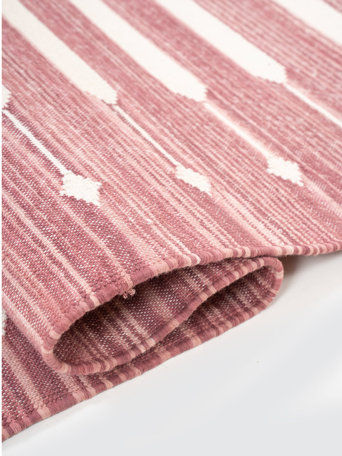 The Subtle Bloom Runner-Pink - cotton runner laid in a hallway view