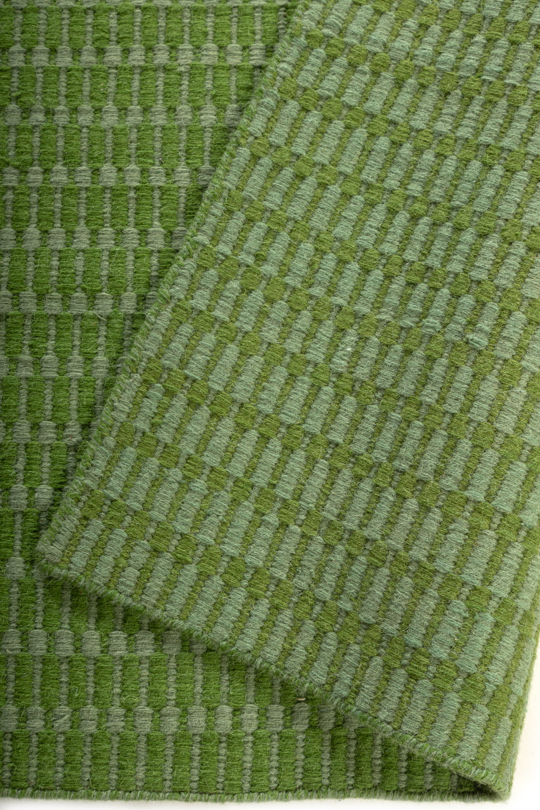 The Subtle Lineage detail of the striped wool surface and edge finishing
