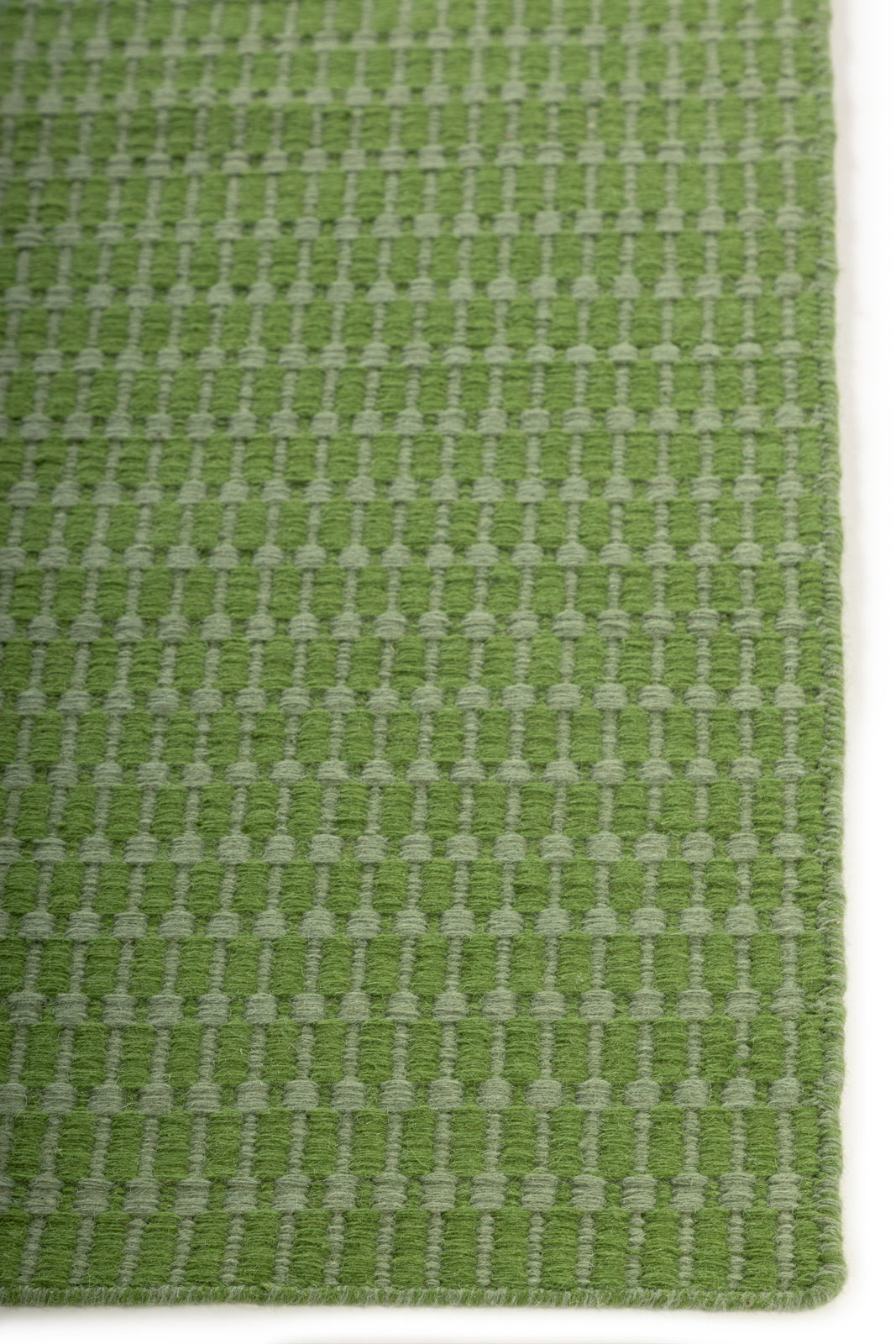 The Subtle Lineage wool rug styled in a living room interior