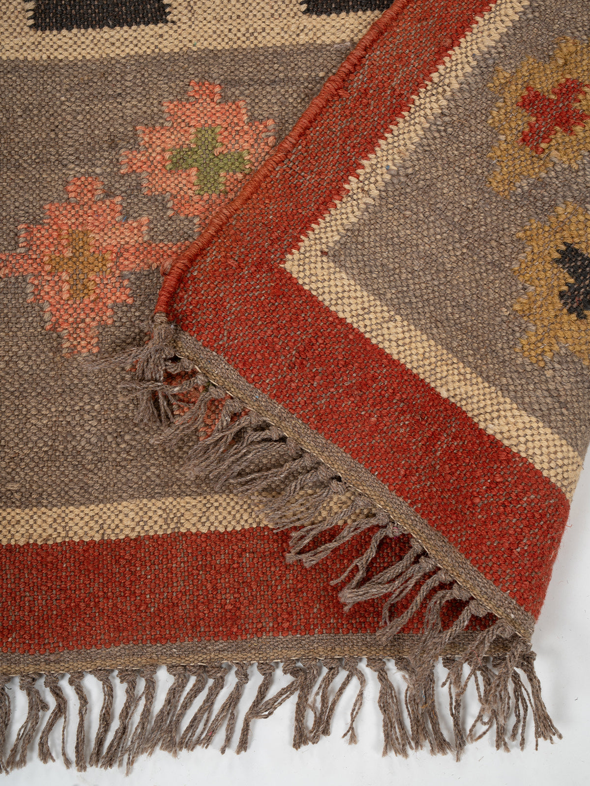 The Tribal Segment Runner detail showing edge binding and wool finishing of the runner