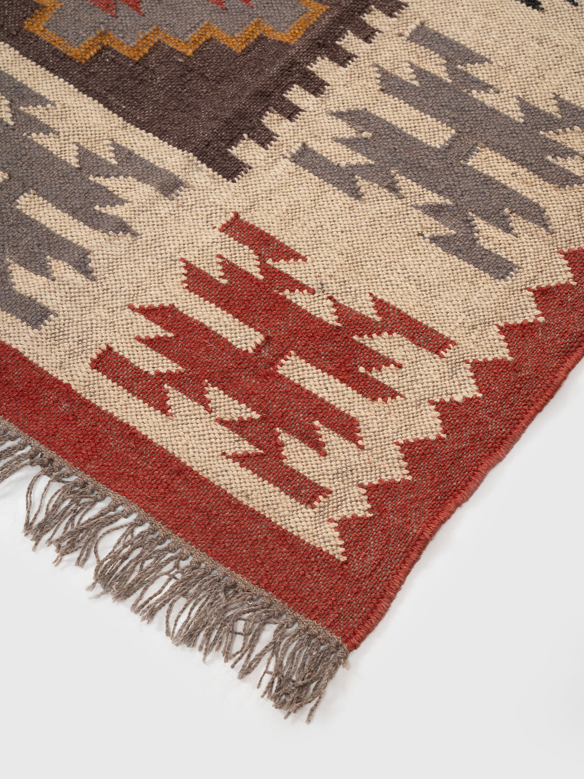 The Tribal Sentinel Rug close-up showing the wool weave and traditional motif