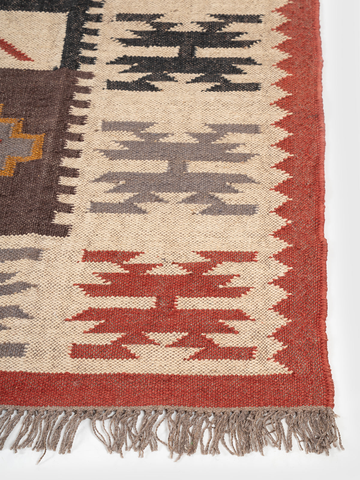 The Tribal Sentinel Rug wool rug styled in a living room interior