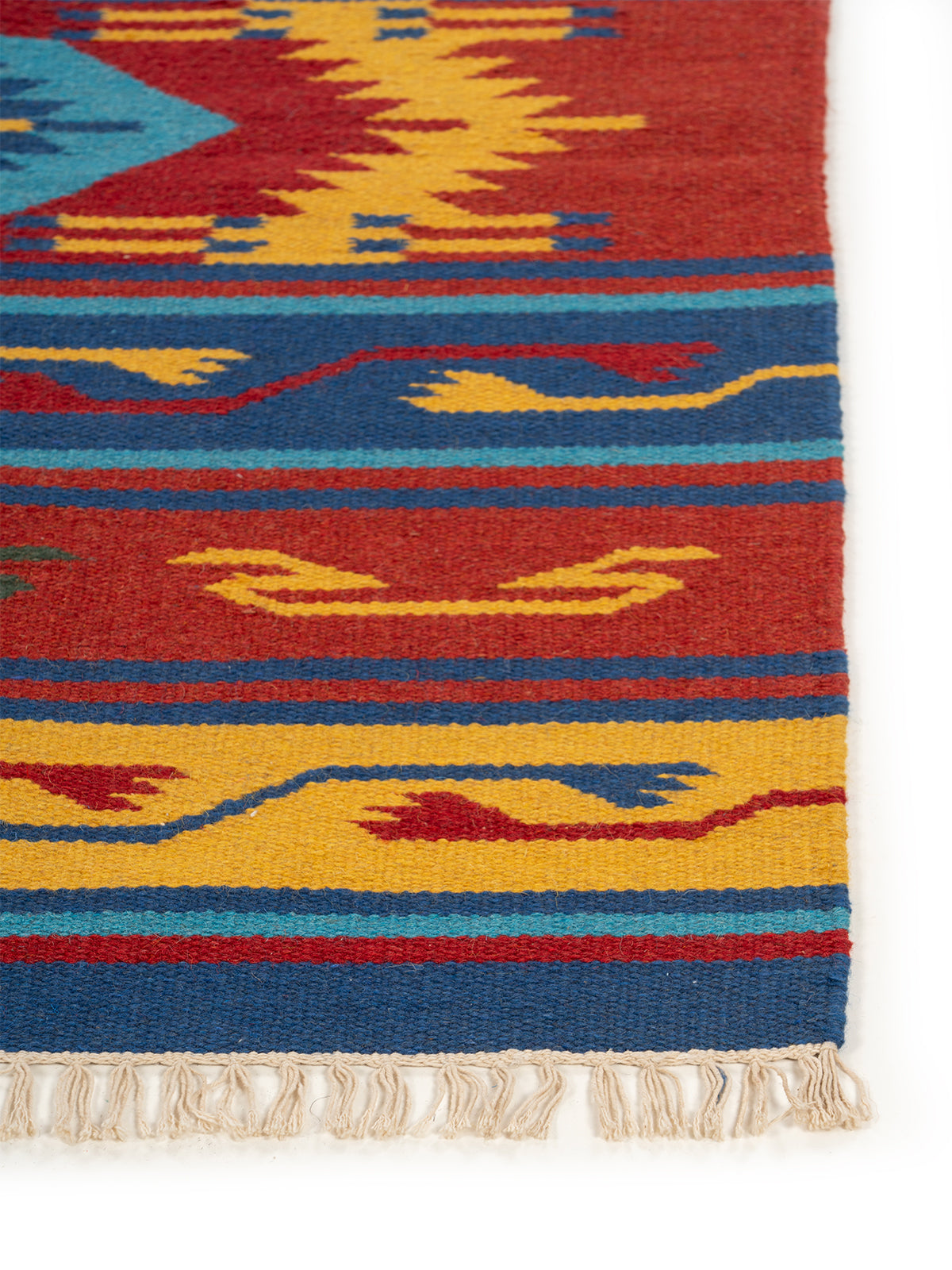 The Tribal Spirit Rug wool rug styled in a living room interior