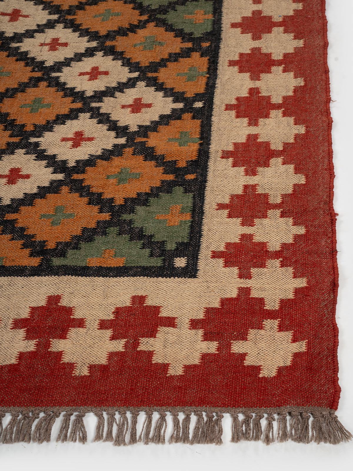 The Tribal Starfield Kilim wool rug styled in a living room interior