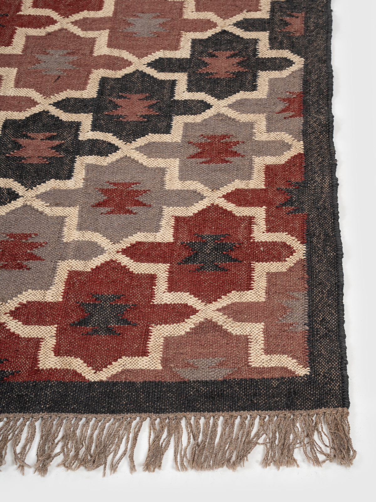 The Twilight Mosaic Rug wool rug styled in a living room interior