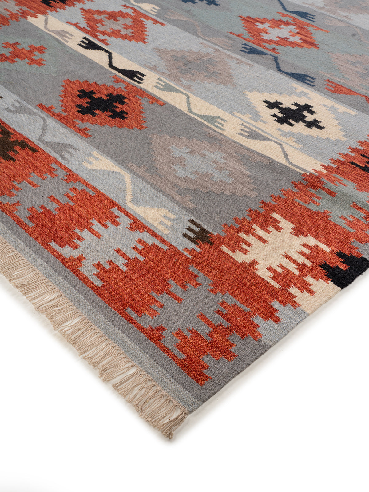 The Warm Stone Rug close-up showing the wool weave and surface texture