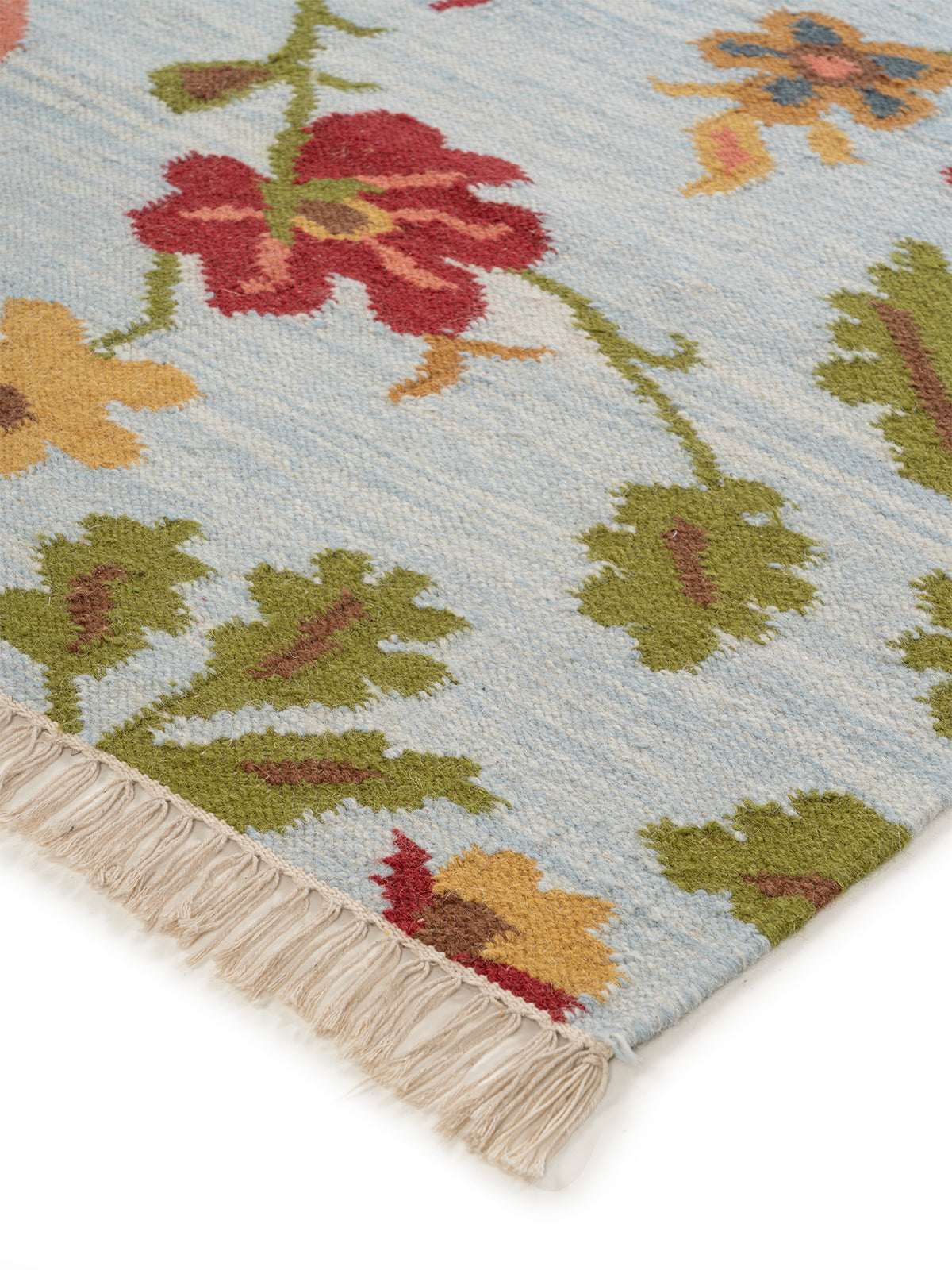 The Wildflower Bloom Rug close-up showing the wool pile and floral motif
