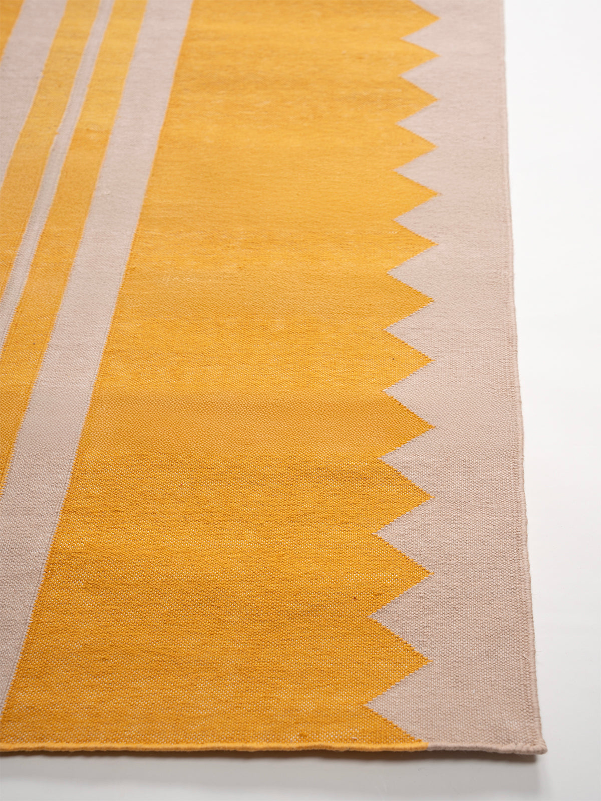 The Zigzag Trail Runner- Lemon - cotton runner laid in a hallway view