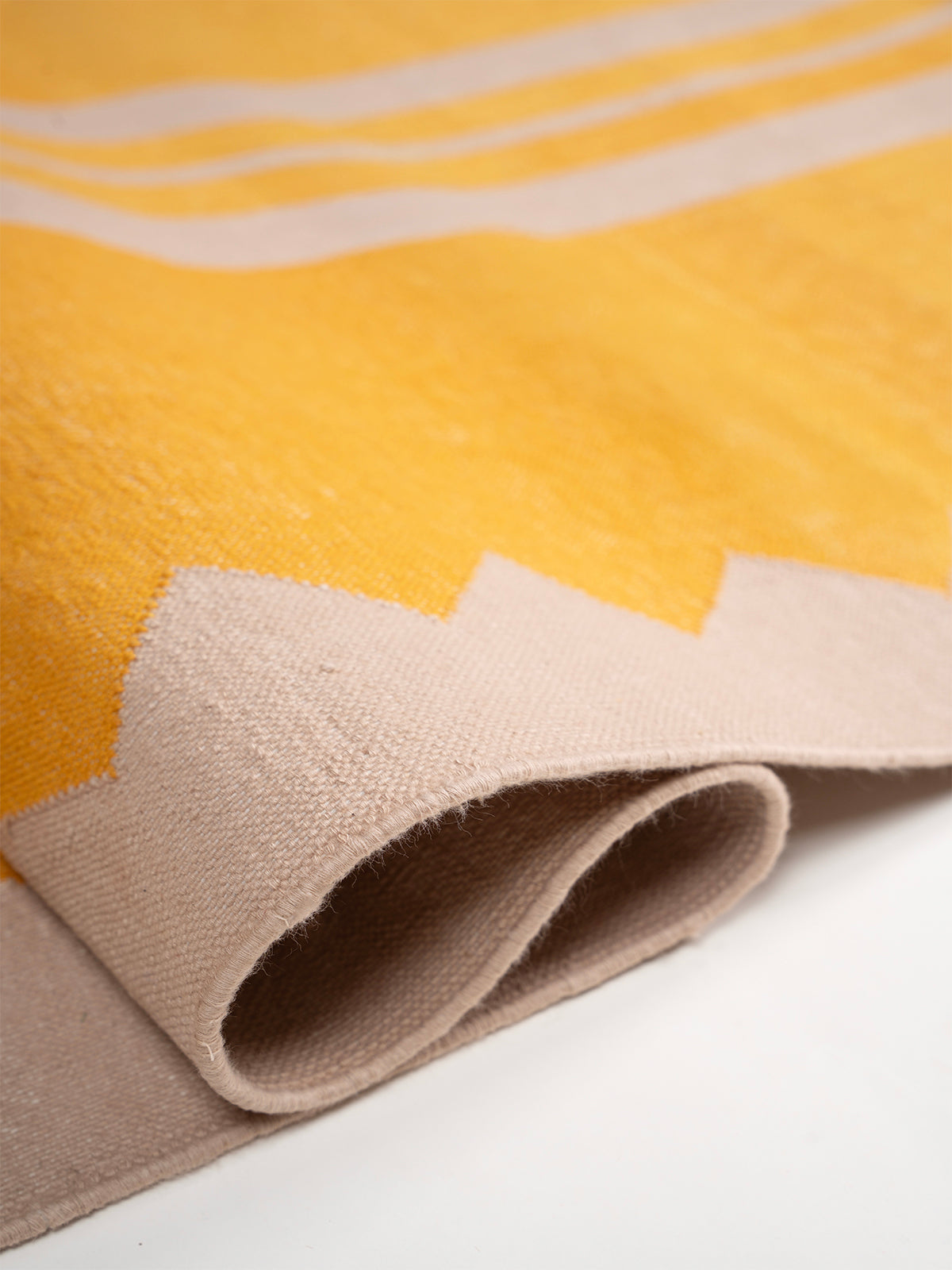 The Zigzag Trail Runner- Lemon detail showing edge binding and cotton finishing of the runner