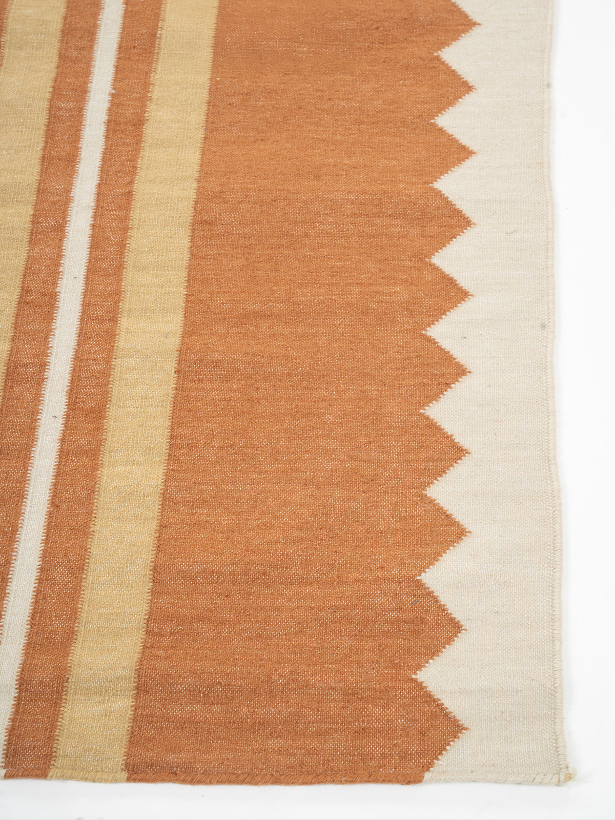 The Zigzag Trail Runner-Rust - cotton runner laid in a hallway view