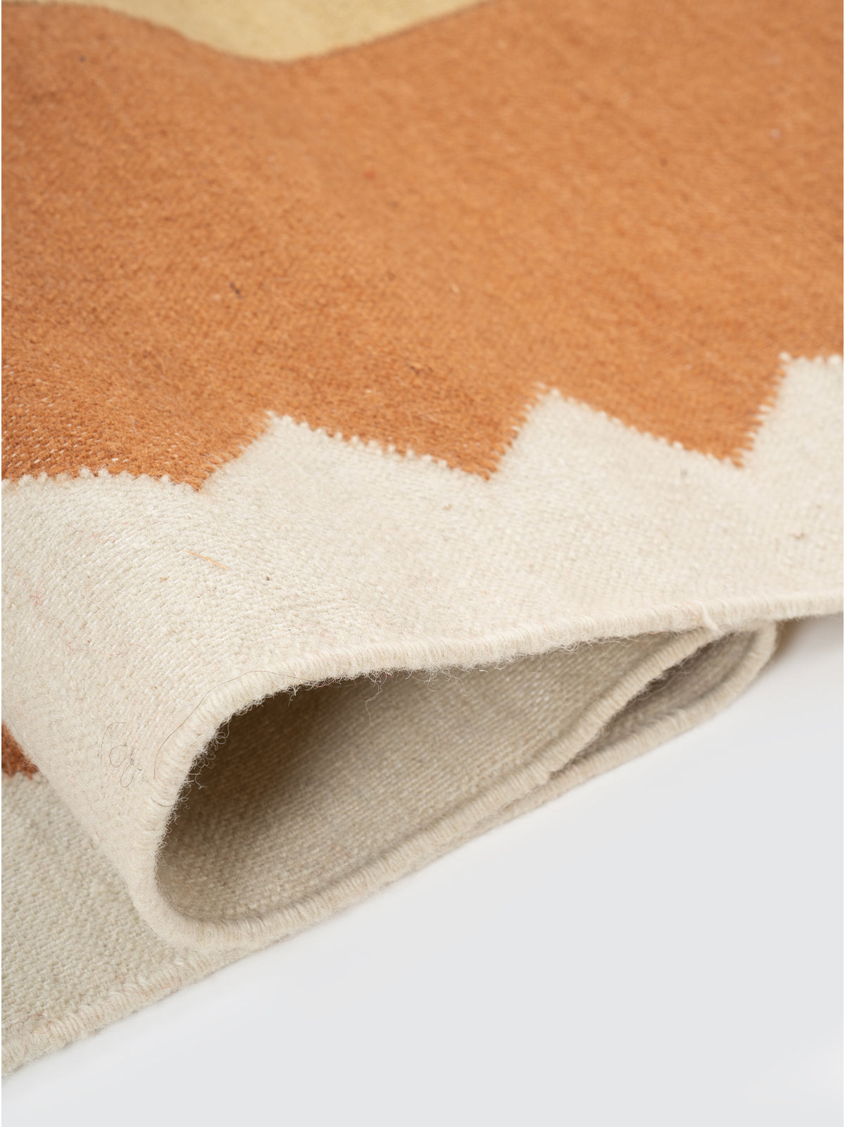 The Zigzag Trail Runner-Rust - cotton runner laid in a hallway view