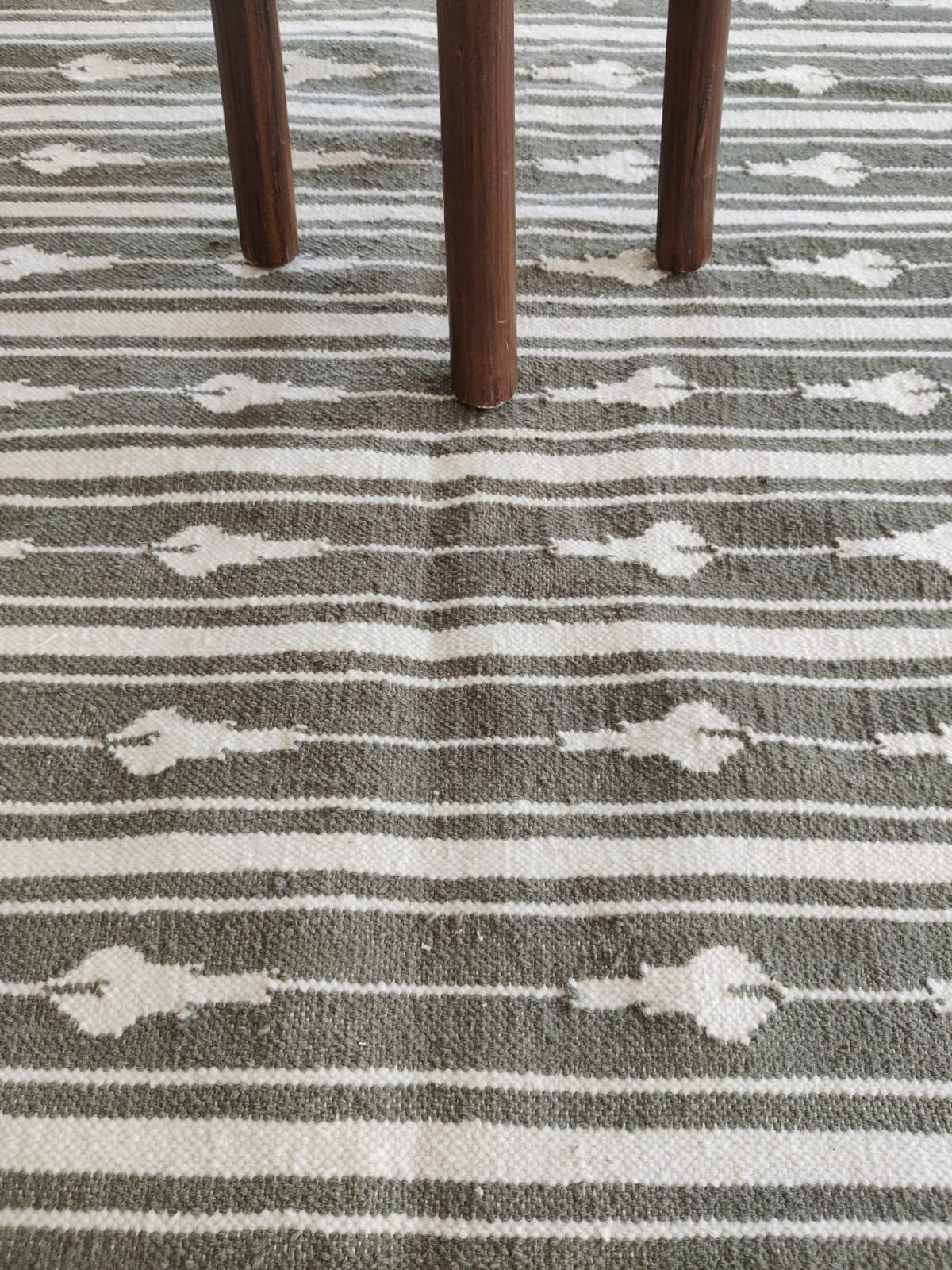 Tideway Wool Rug-Brown wool rug styled in a living room interior