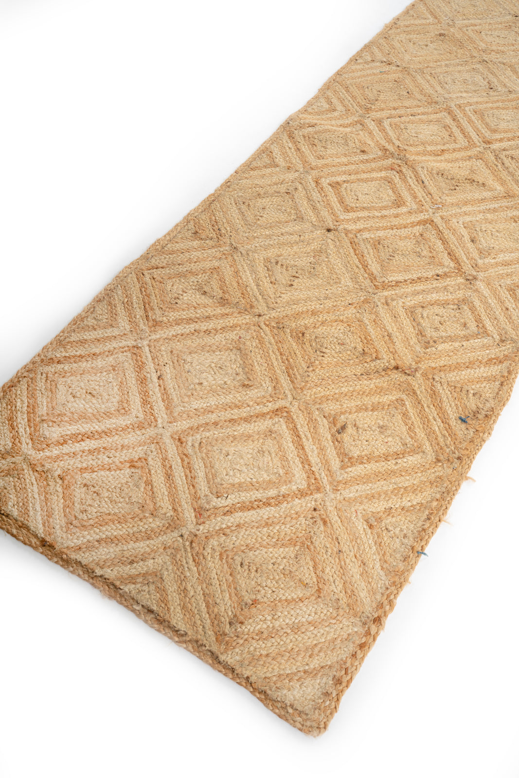 Tiko jute braided area runner close-up showing the jute weave and texture surface