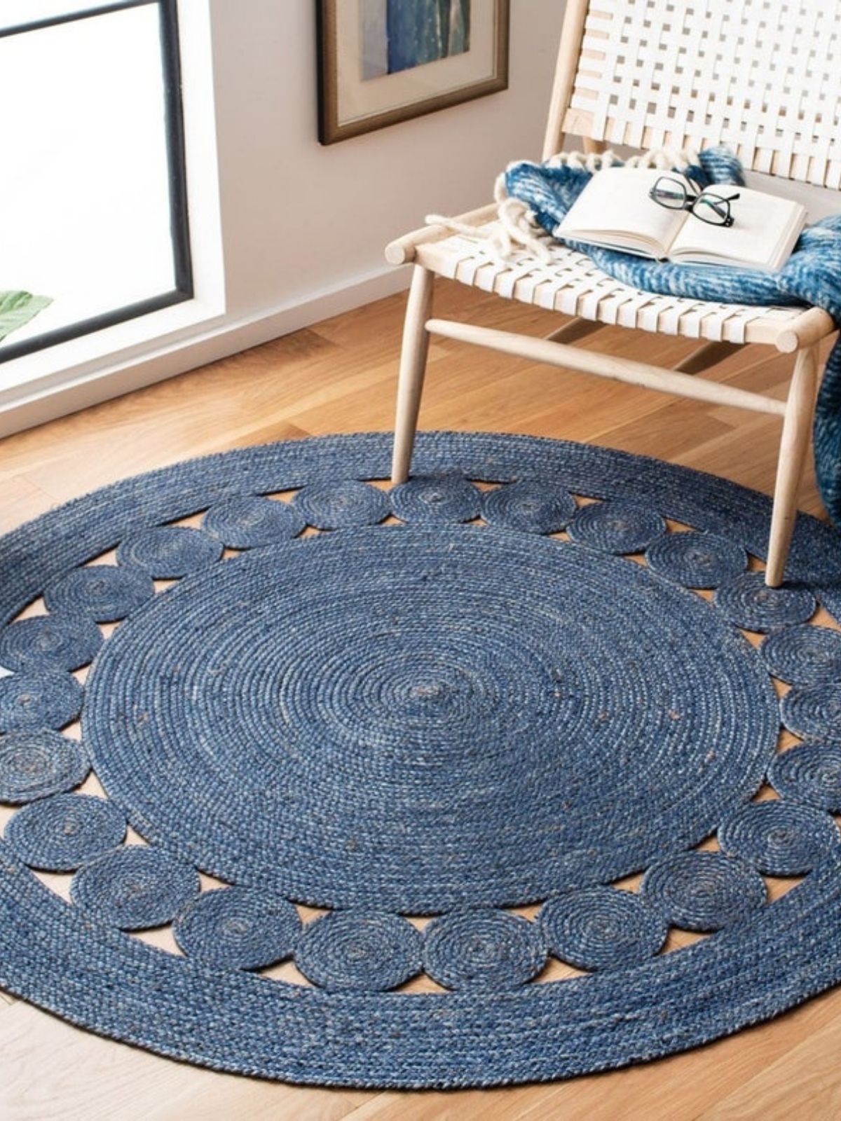 Tunis round jute rug-Navy jute rug styled in a living room interior