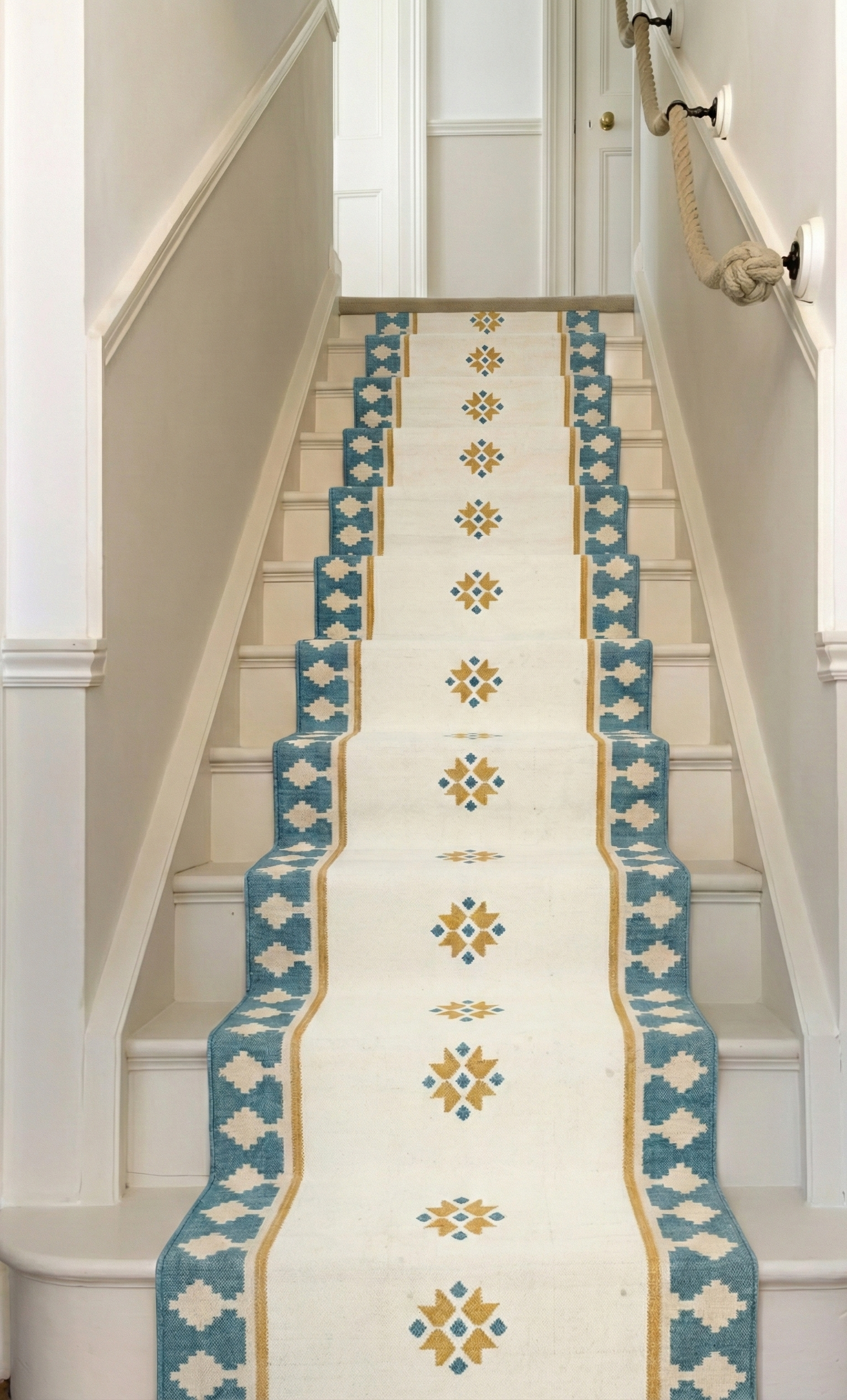 Turquoise Crossroads wool rug styled in a living room interior