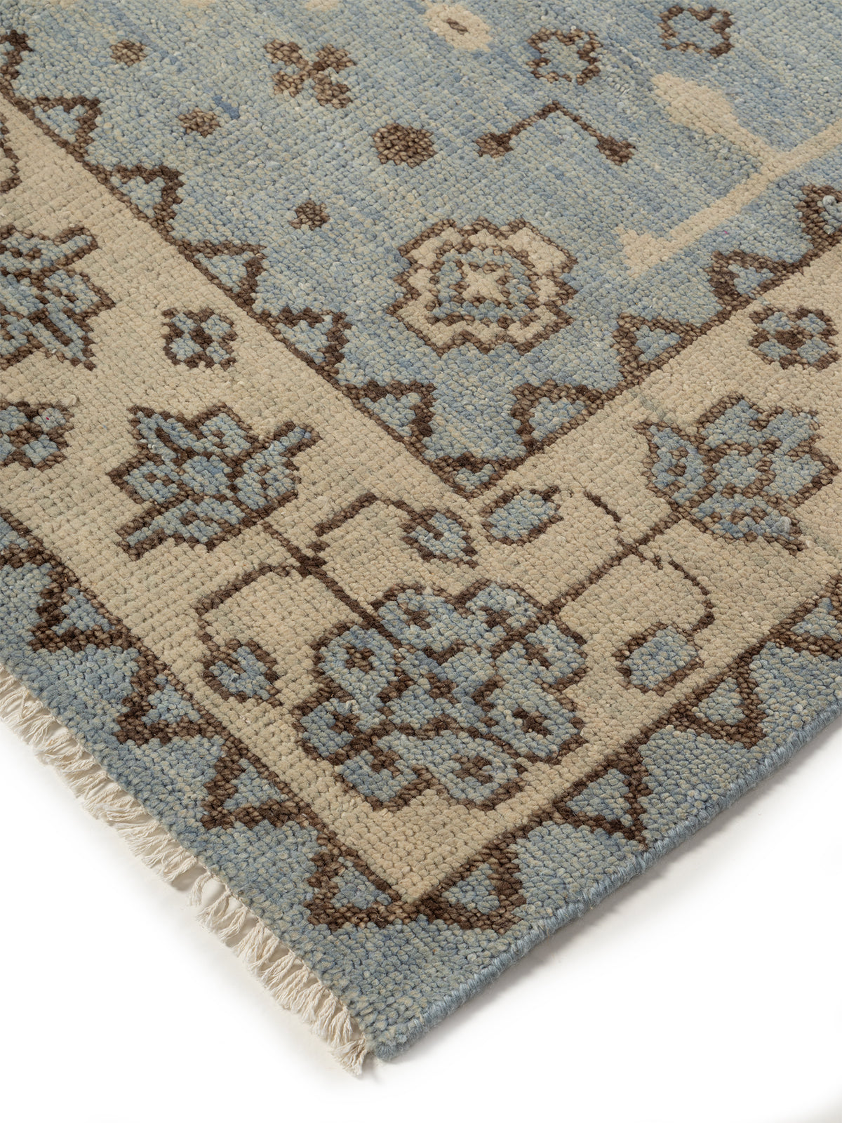 Twilight Bloom Oushak Rug close-up showing the wool pile and floral motif