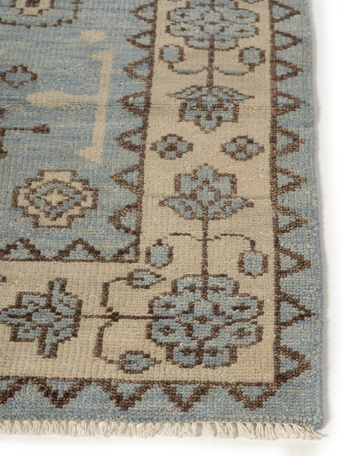 Twilight Bloom Oushak Rug wool rug styled in a living room interior