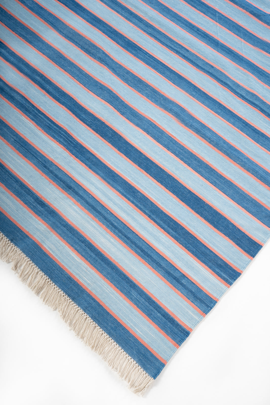 Varanasi Sunset Flatweave Rug close-up showing the cotton weave and striped pattern