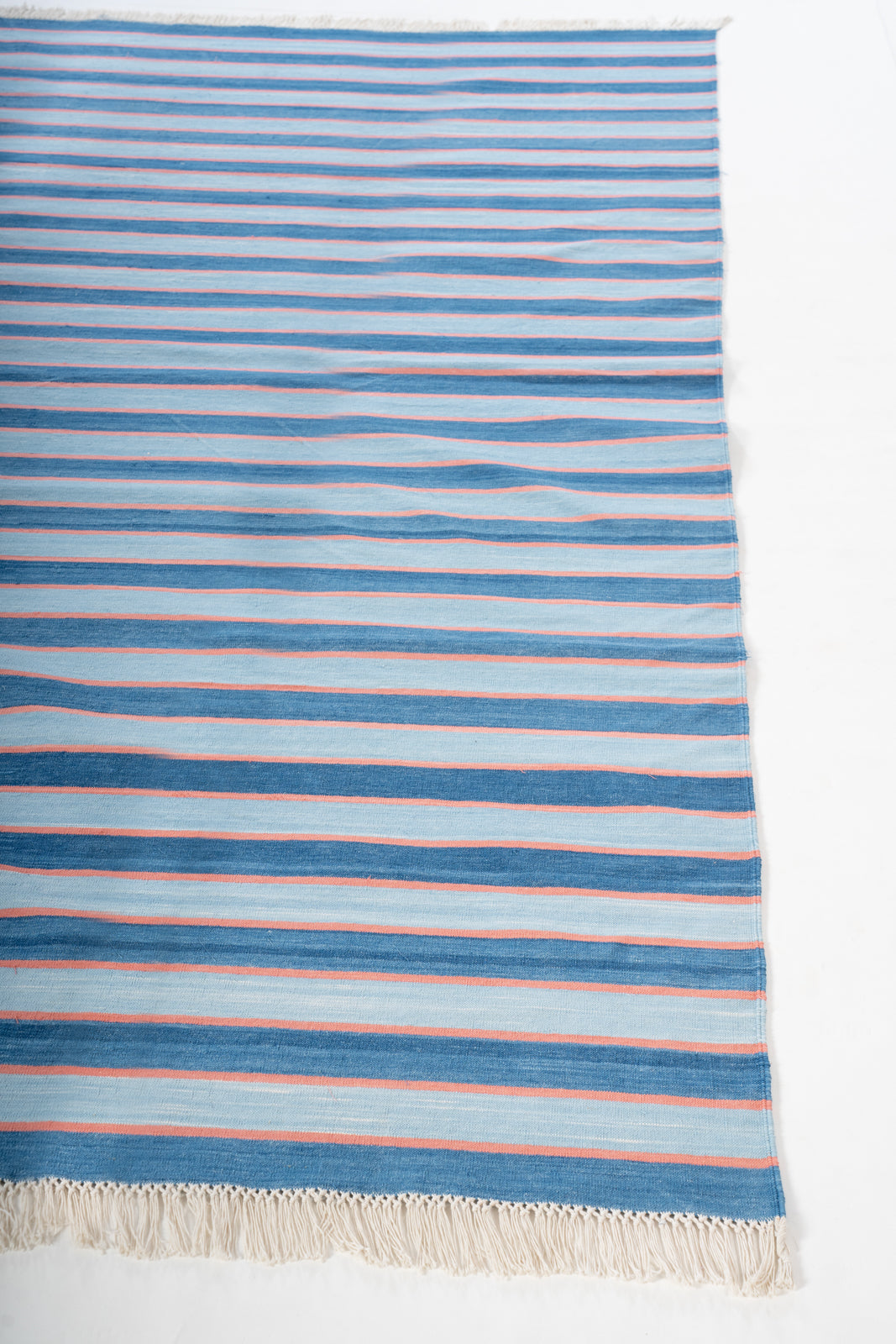 Varanasi Sunset Flatweave Rug cotton rug styled in a living room interior