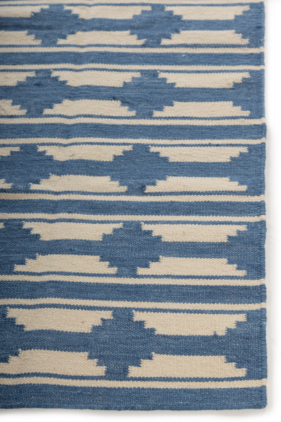 Velden Calm Rug wool rug styled in a living room interior