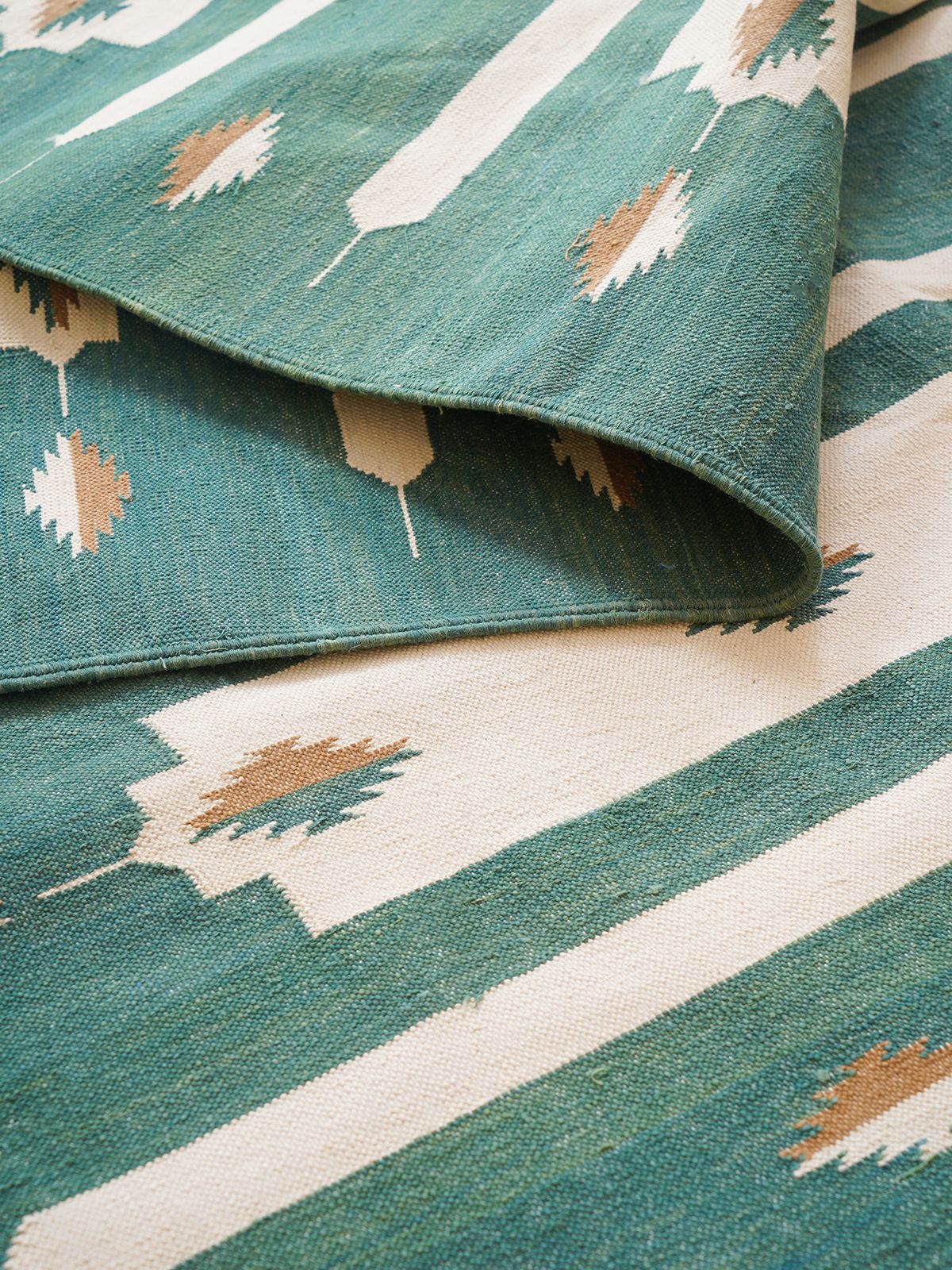 Whisper Tie-Dye Flatweave Rug-Green detail showing the textured cotton surface and finishing