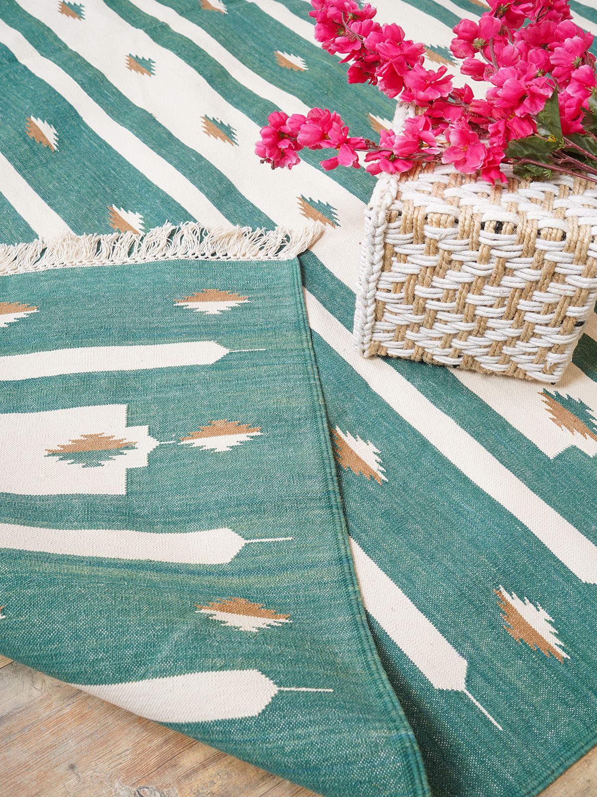 Whisper Tie-Dye Flatweave Rug-Green cotton rug styled in a living room interior