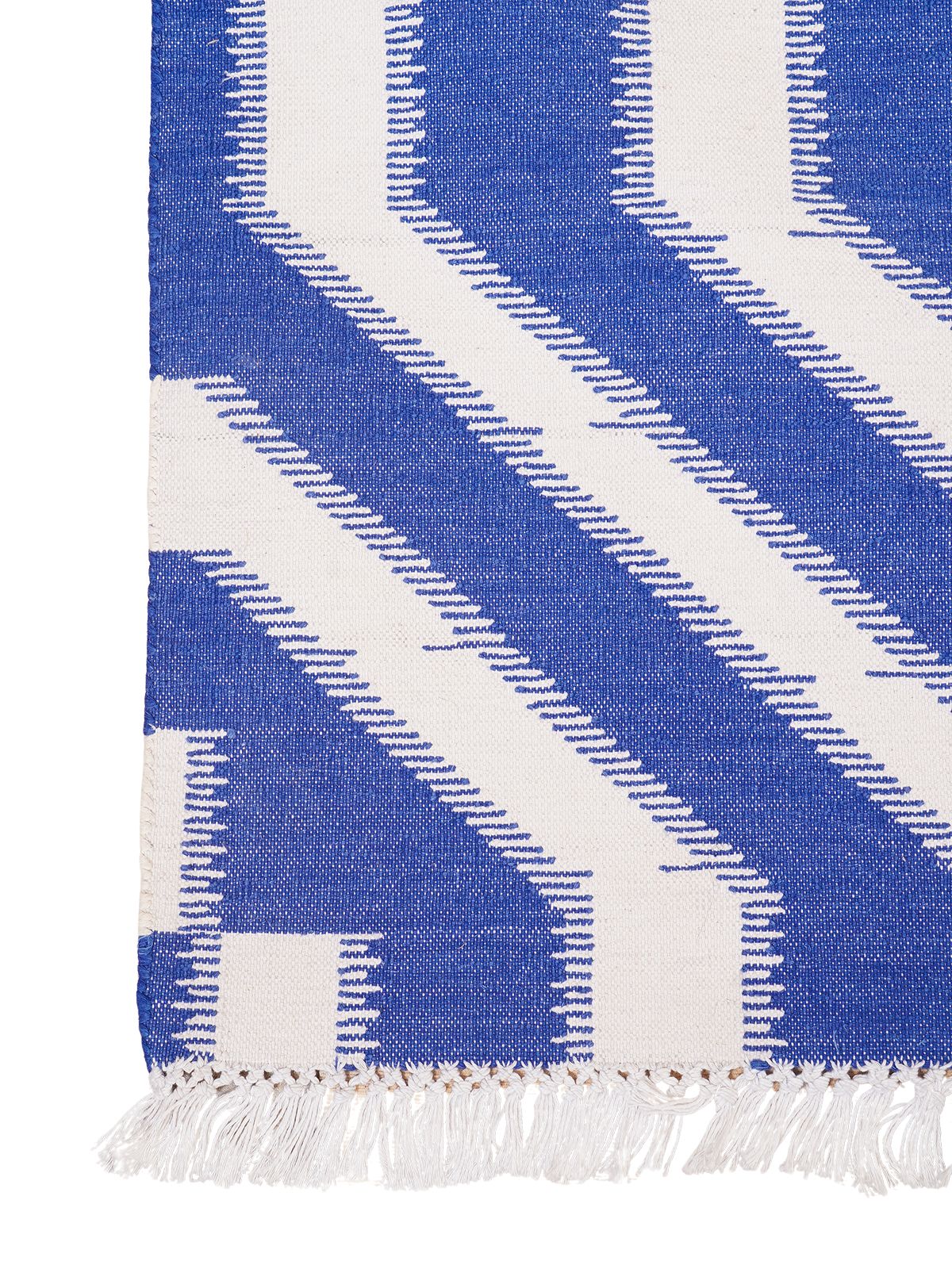 White Wave Ikat Flatweave Rug close-up showing the cotton weave and geometric motif