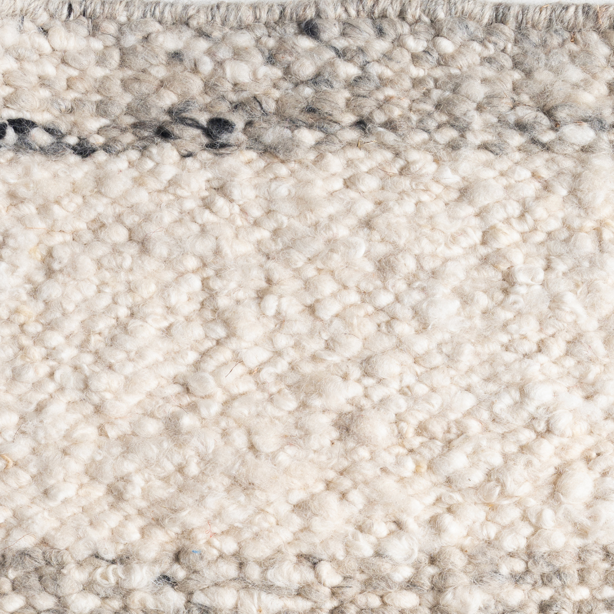 Wool Glen : Granite close-up showing the handcarded wool weave and surface texture