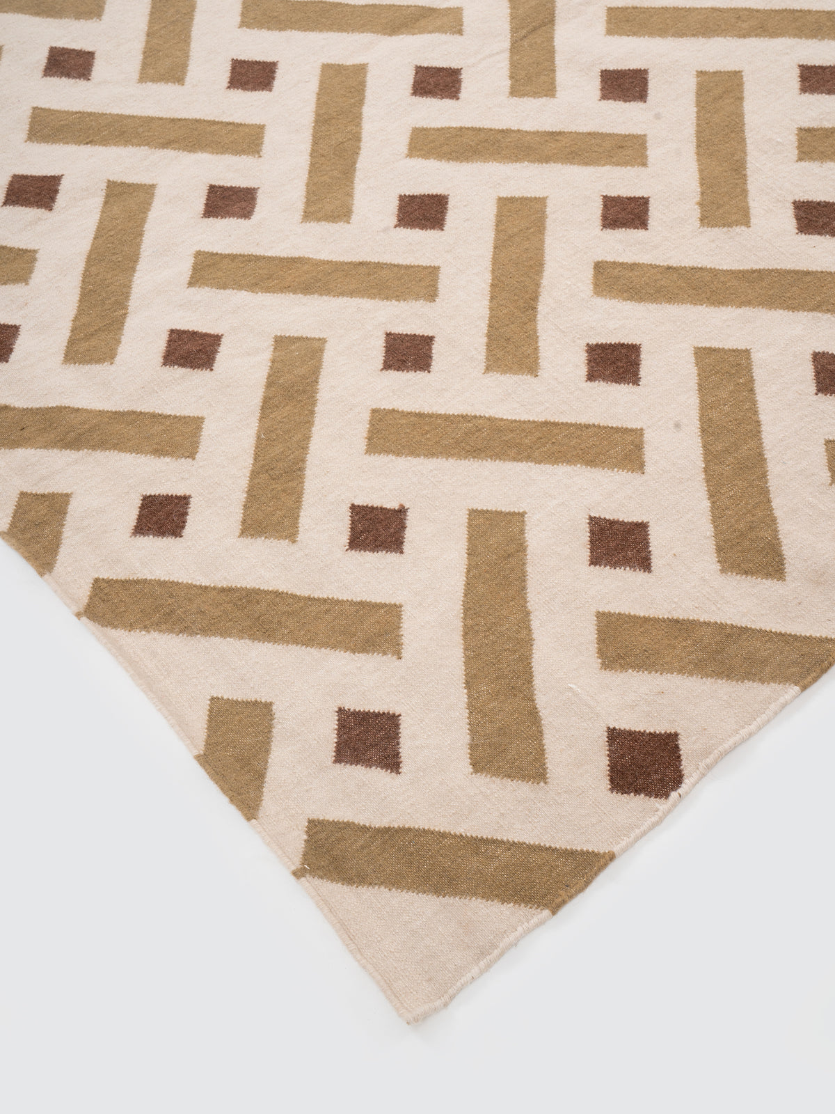 Woven Heritage Wool Rug close-up showing the wool weave and traditional motif