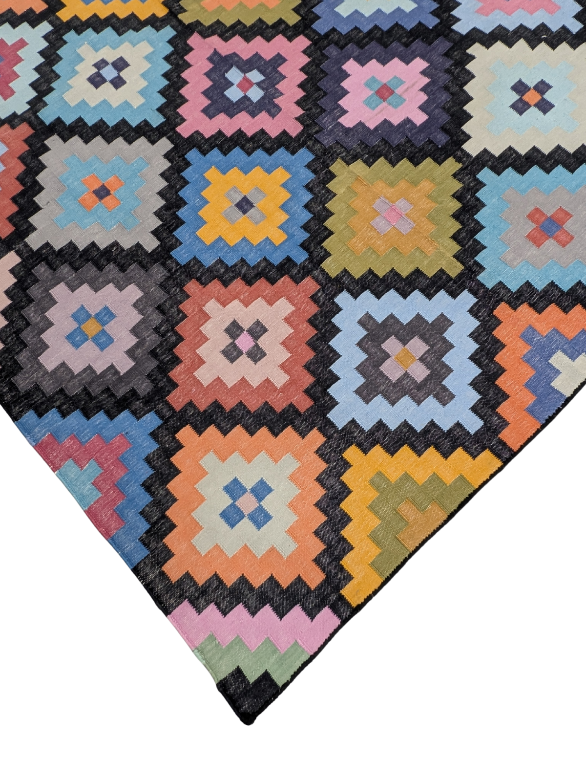 Woven Whimsy Kilim Dhurrie Rug close-up showing the cotton weave and geometric motif