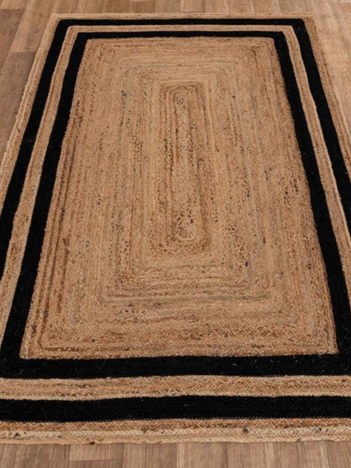 Niamey double border jute braided area rug