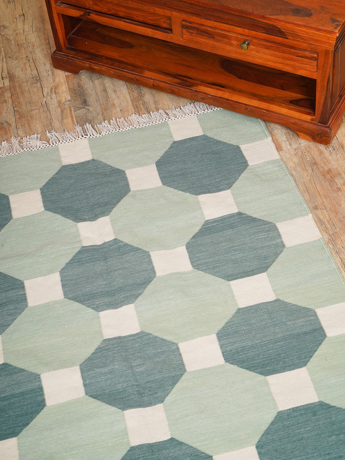 Elevate your living space with our Handmade Octagonal Tapestry Wool Rug, a true testament to craftsmanship and timeless design. This luxurious wool rug features a unique octagonal shape adorned with intricate tapestry patterns, making it the perfect centerpiece for any room.