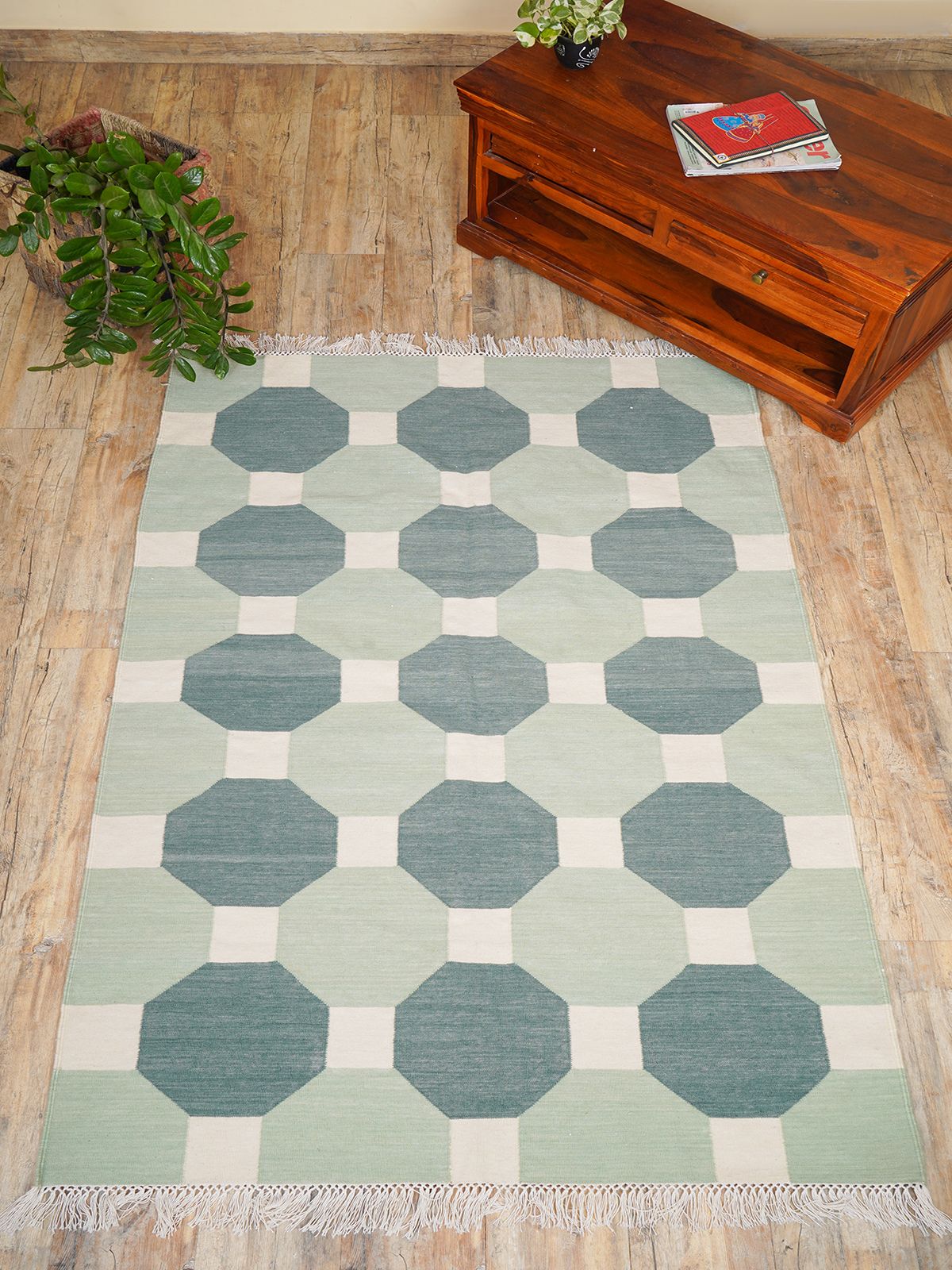 Elevate your living space with our Handmade Octagonal Tapestry Wool Rug, a true testament to craftsmanship and timeless design. This luxurious wool rug features a unique octagonal shape adorned with intricate tapestry patterns, making it the perfect centerpiece for any room.