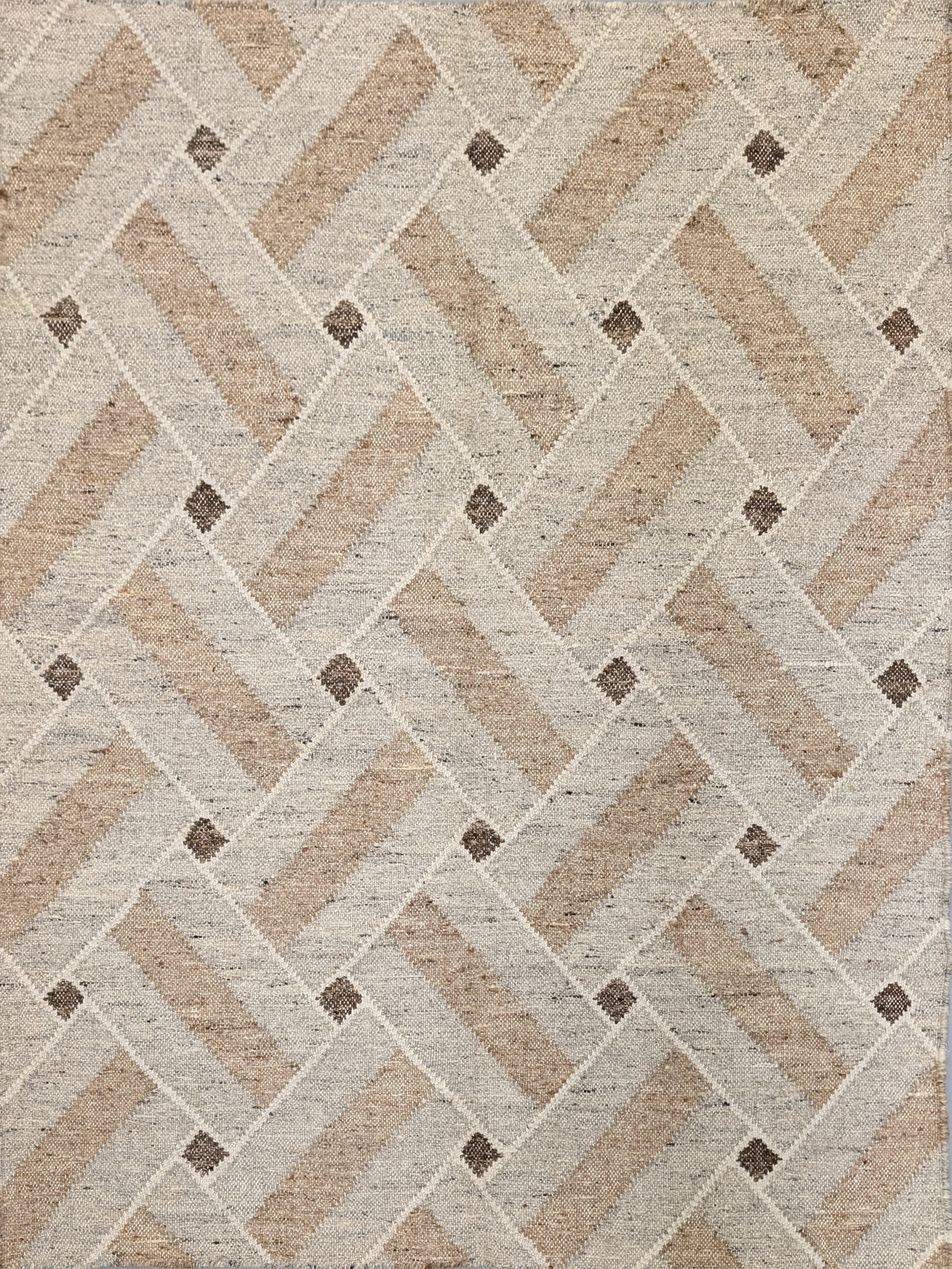 Timeless elegance meets artisanal craftsmanship in the Woven Heritage Wool Rug. Featuring a sophisticated interwoven pattern in warm neutral tones, this handwoven flatweave rug brings understated luxury to any space. Crafted from high-quality wool, its soft, textured surface and earthy hues of beige, taupe, and ivory create a refined yet cozy ambiance. Accented with subtle geometric details, this versatile piece blends seamlessly into modern, Scandinavian, or traditional interiors.