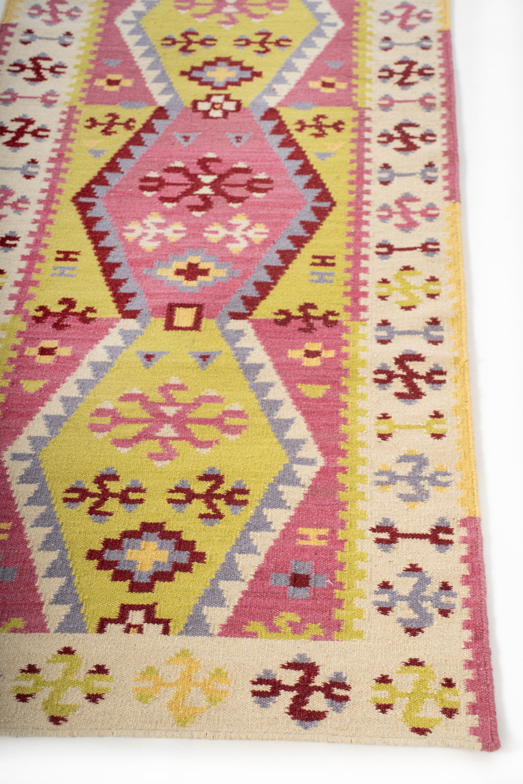 Alwar Blossom Wool Runner wool stair runner styled on a staircase in a designed interior