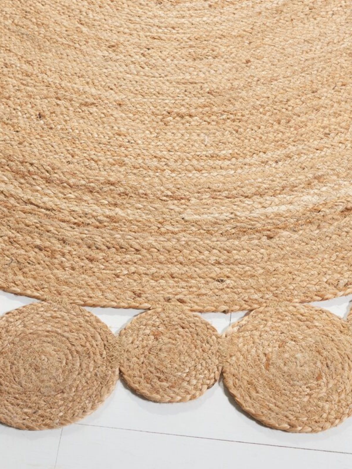 Andony round jute rug close-up showing the jute weave and surface texture