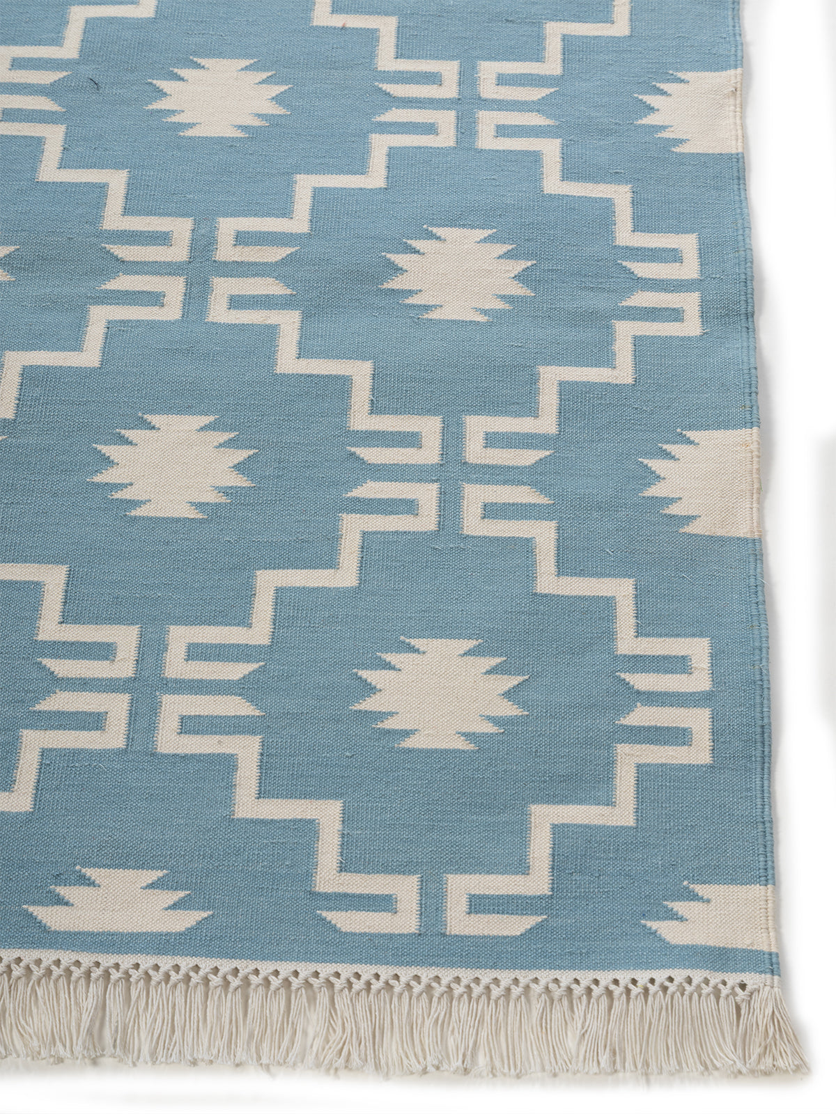 Arctic Echo Rug-Blue cotton rug styled in a living room interior