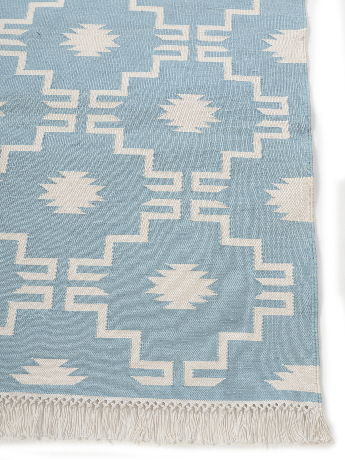 Arctic Echo Rug cotton rug styled in a living room interior