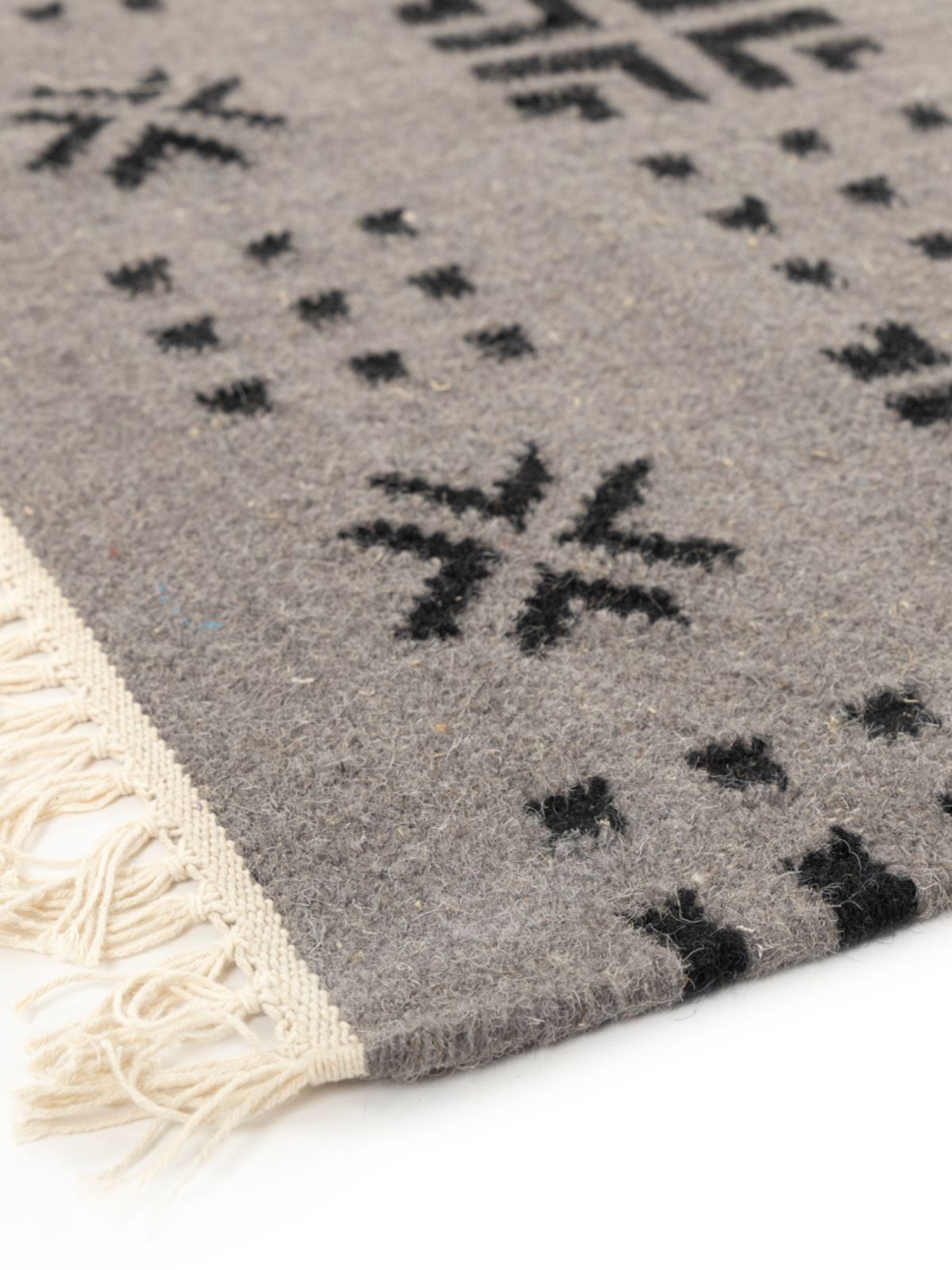 Arrow Dot Weave Rug close-up showing the cotton weave and geometric motif