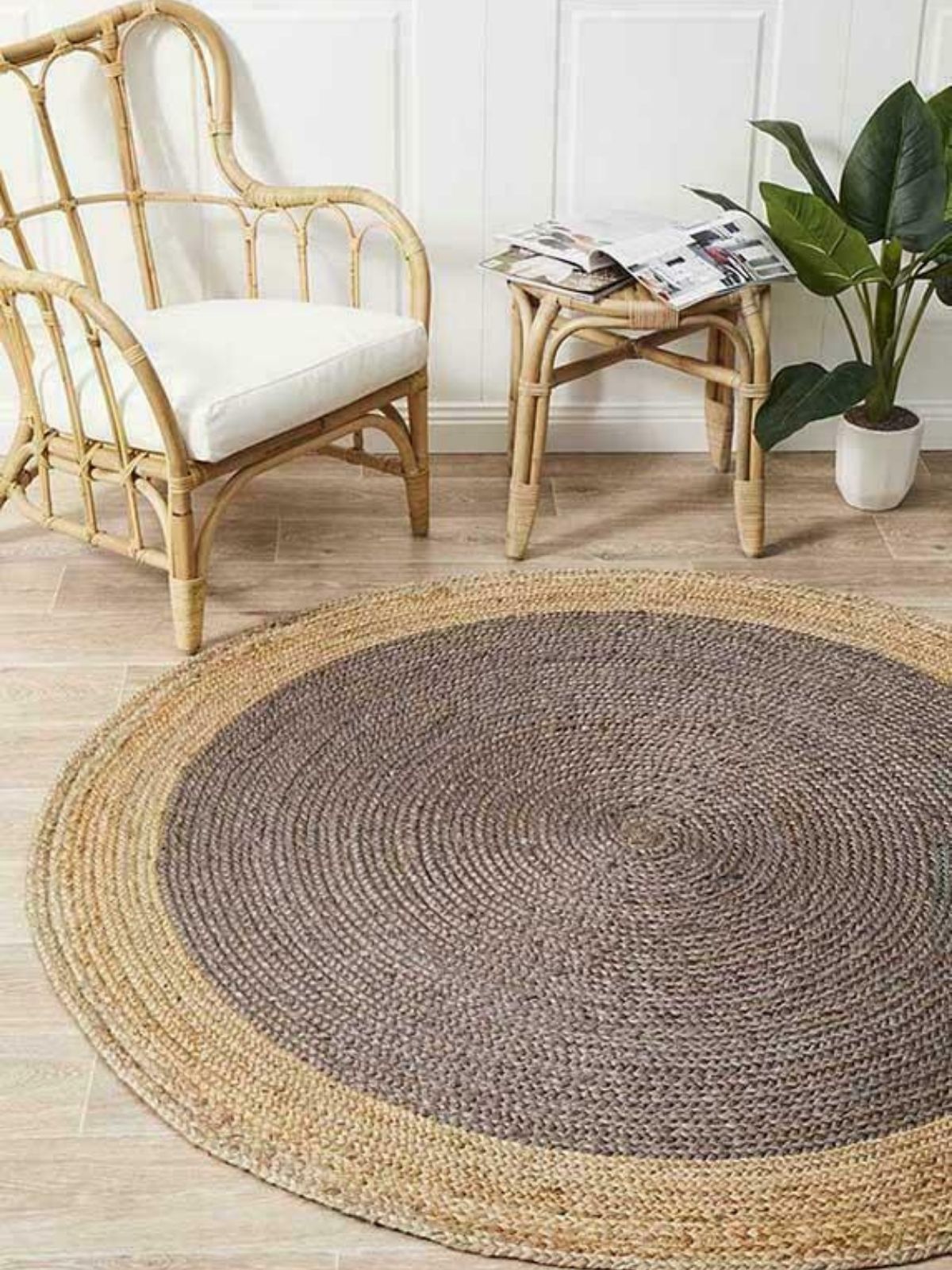 Asmara bordered round rug-Grey cotton rug styled in a living room interior