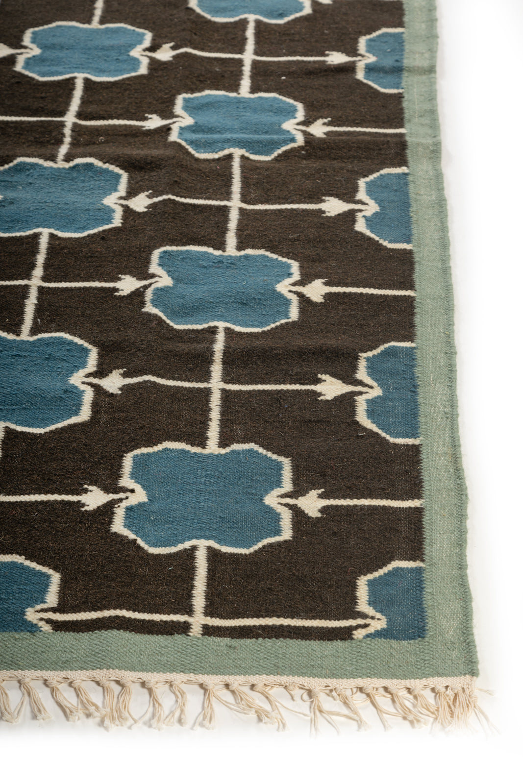 Azure Trellis Rug wool rug styled in a living room interior