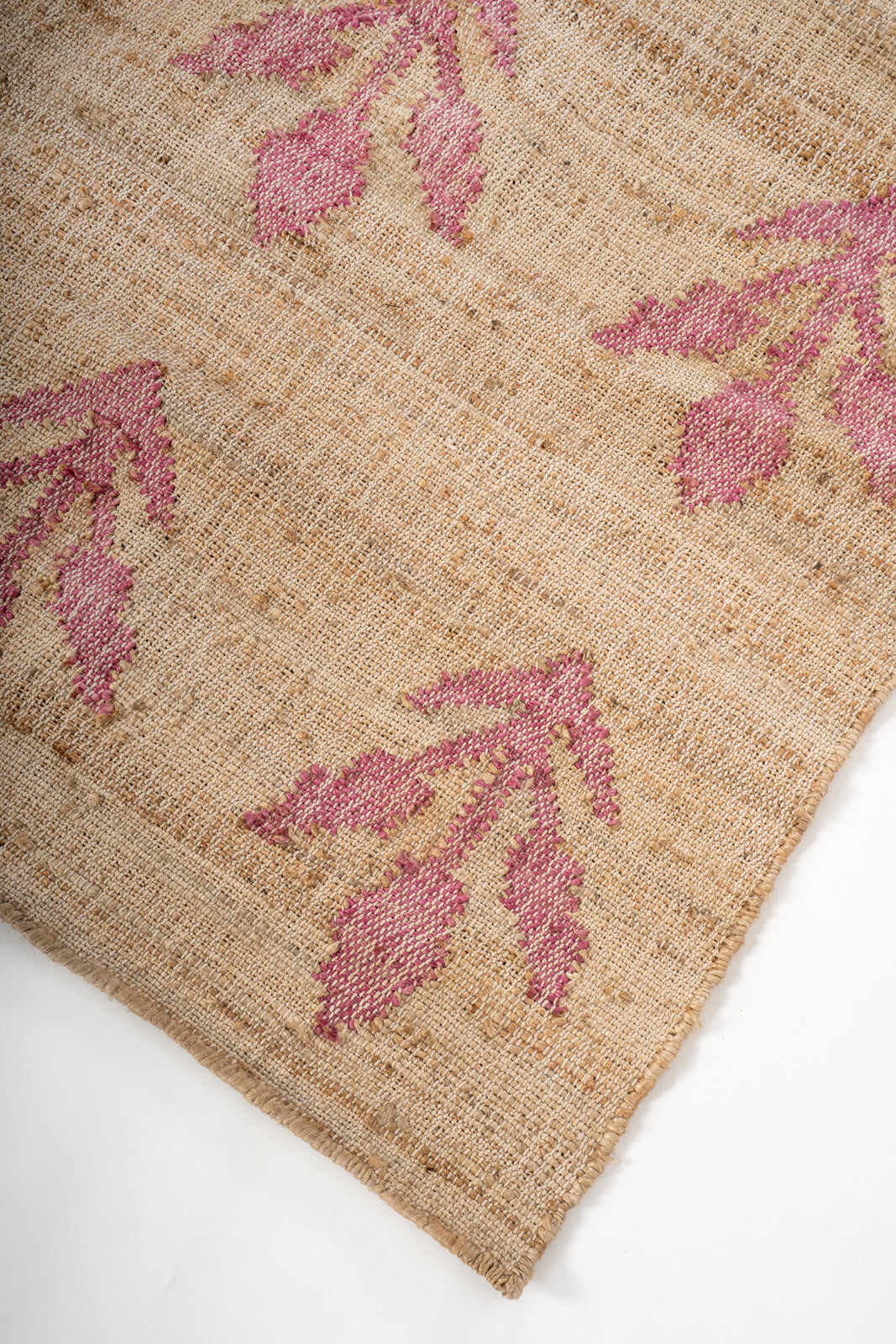 Blush Garden Jute Rug close-up showing the jute pile and floral motif
