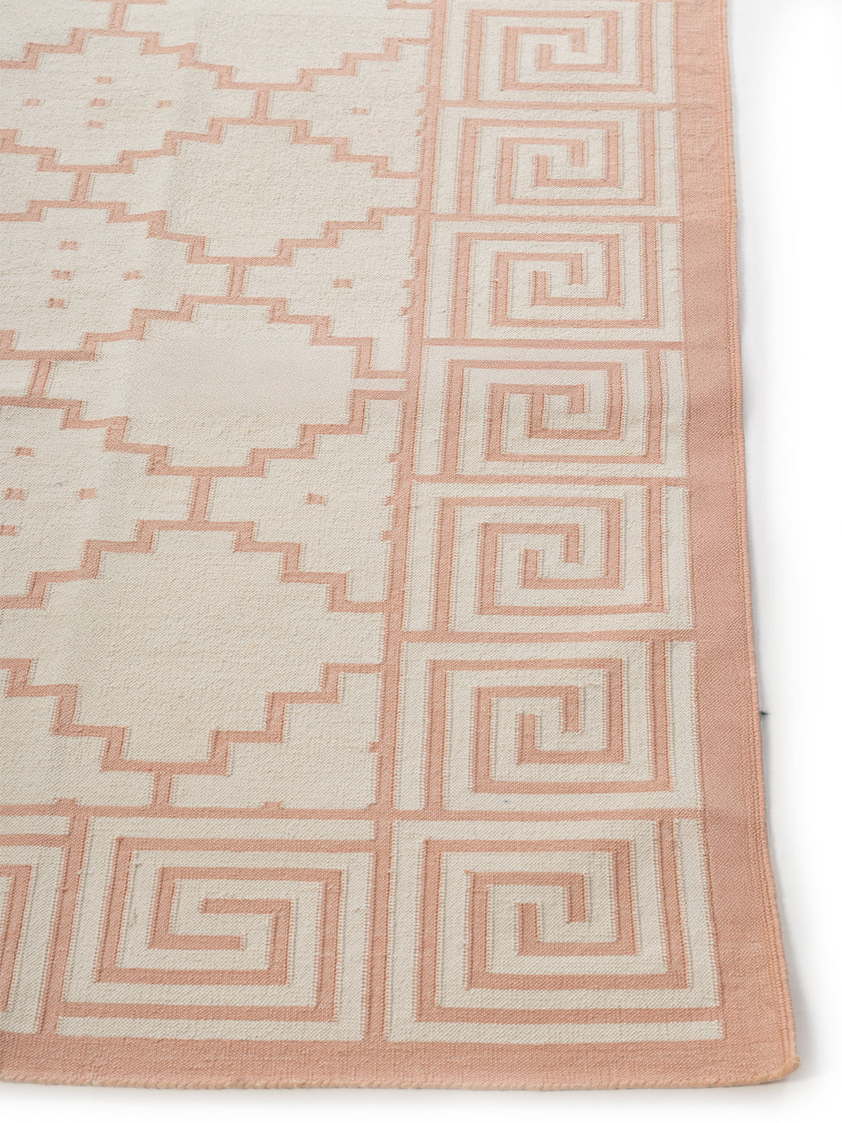 Blush Maze Dhurrie Rug cotton rug styled in a living room interior