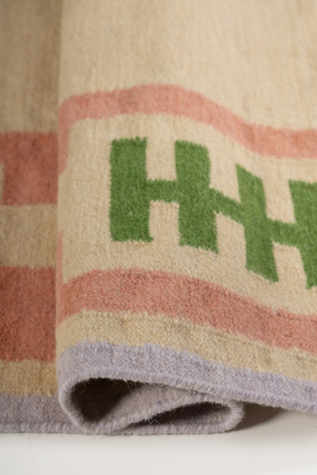 Blush Meadow Border Rug - edge detail showing wool finishing