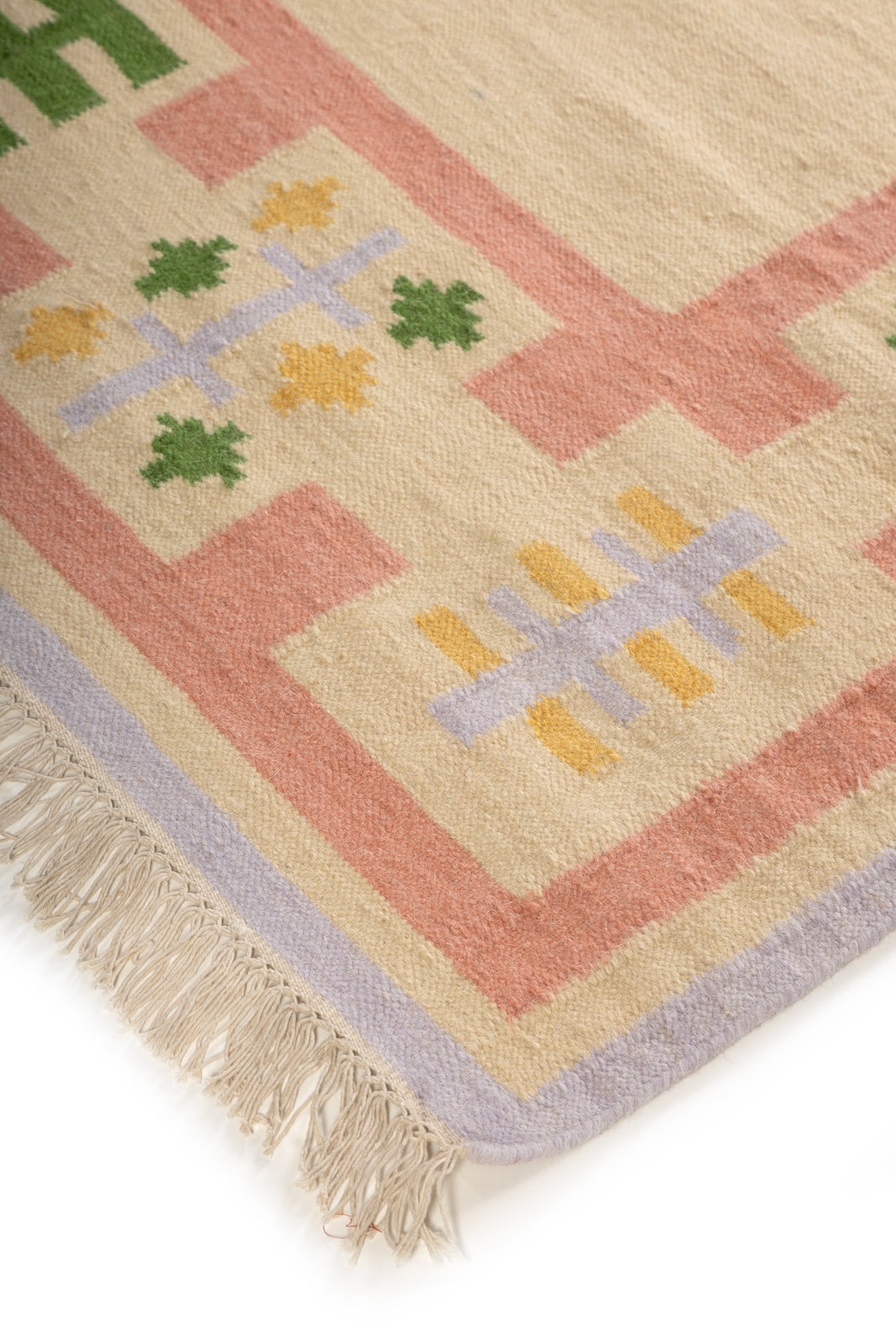 Blush Meadow Border Rug close-up showing the wool pile and floral motif