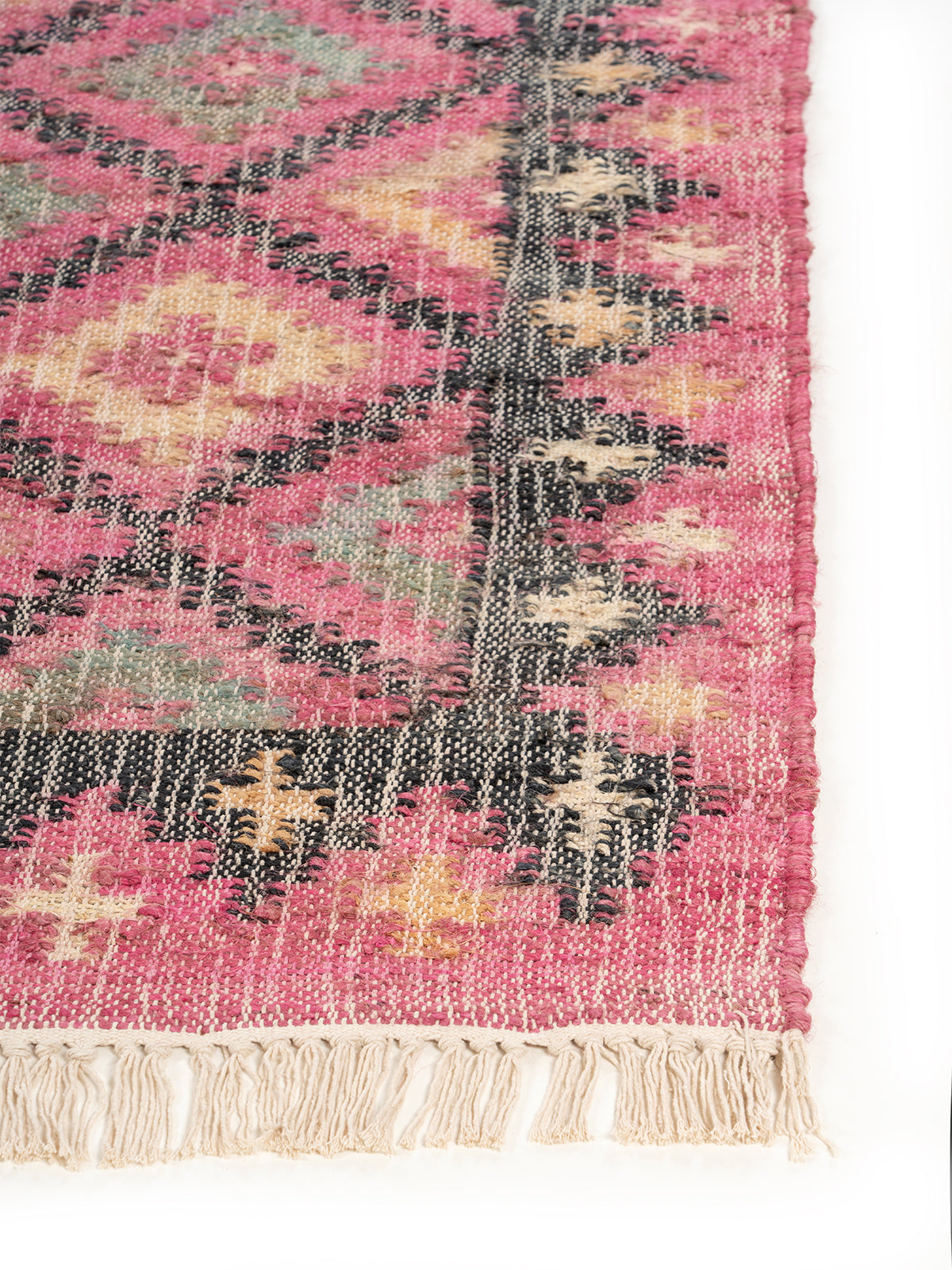 Boho Bloom jute rug styled in a living room interior with timber and linen