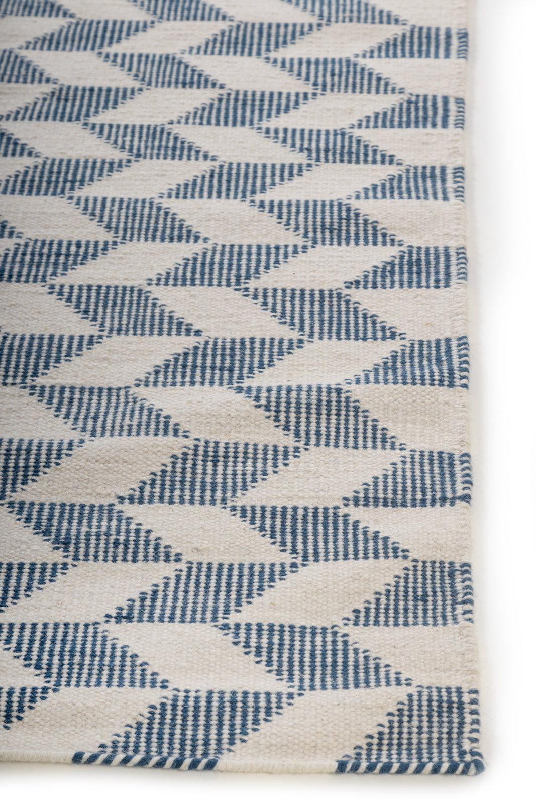 Breezehaven Rug wool rug styled in a living room interior